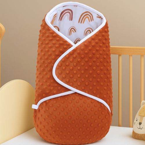Nid d'ange bébé orange brûlé, câlin cannelle chaleureux et douillet pour nouveau-né.