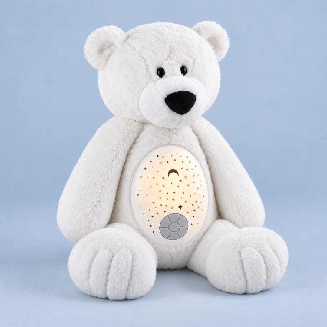 Peluche ours polaire Flocon avec son dôme projecteur allumé sur fond bleu