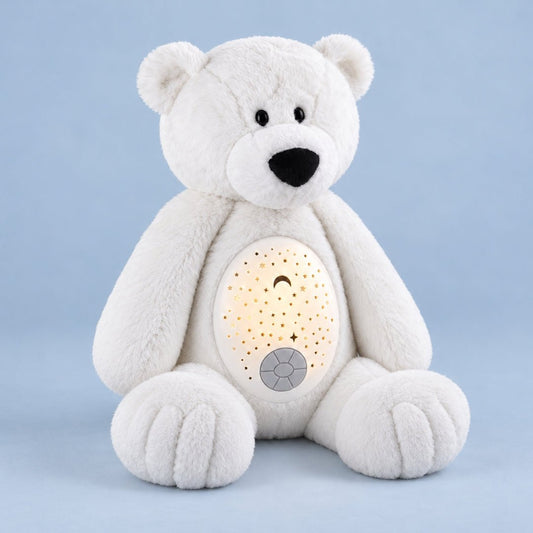 Peluche ours polaire Flocon avec son dôme projecteur allumé sur fond bleu