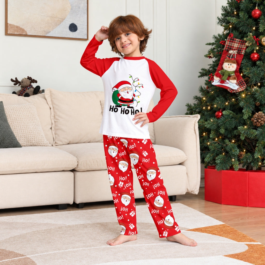 Garçon en pyjama de Noël enfant Père Noël rouge et blanc
