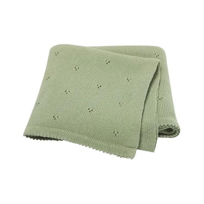 Couverture bébé en coton tricoté coloris vert sauge, motif ajouré