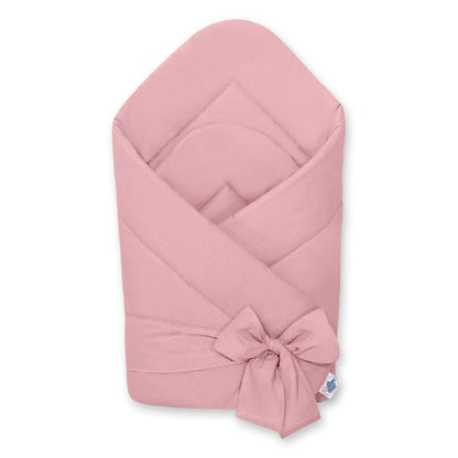 Couverture d'emmaillotage unie coloris rose poudré, vue pliée avec lien noué