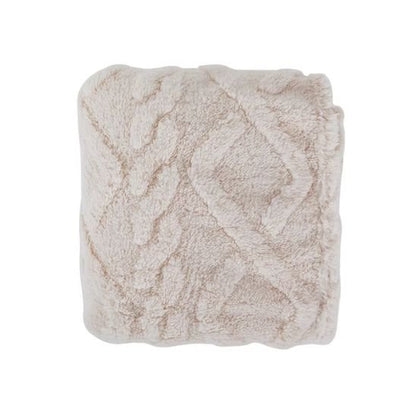 Couverture lit bébé crème en coral fleece pliée, teinte lumineuse et douce