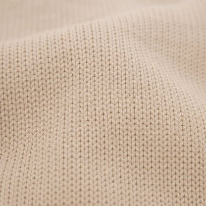 Gros plan sur la texture du tricot de la couverture pour bébé