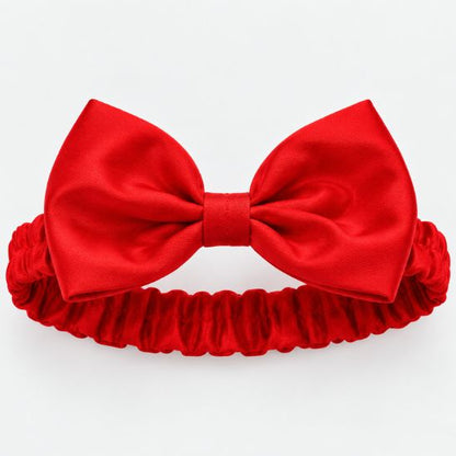Bandeau rouge à nœud inclus avec le déguisement princesse bébé