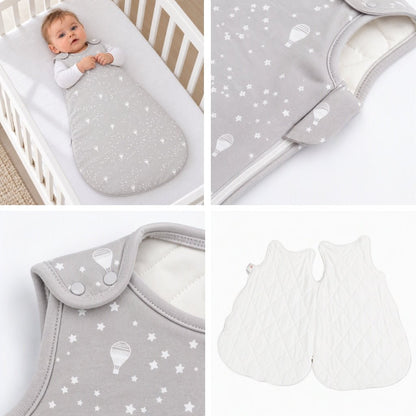 Gigoteuse bébé naissance grise étoilée : bébé dans son lit, zip latéral avec rabat, pressions aux épaules et doublure matelassée