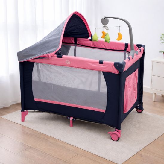 Lit parapluie bébé pliable avec mobile bébé utilisé comme parc bébé