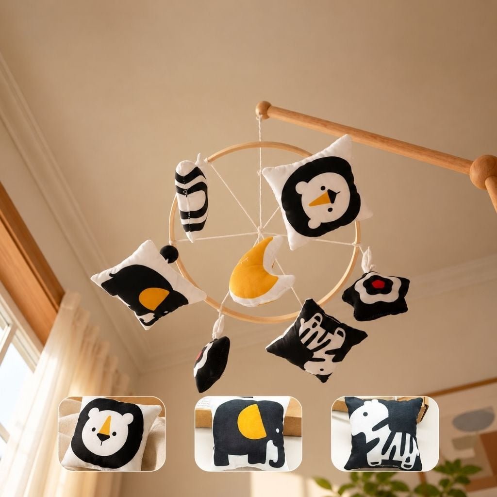 mobile bébé contrasté Pleine Lune vu de dessous avec lion, éléphant et zèbre noir et blanc et lune moutarde