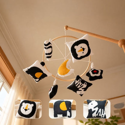 mobile bébé contrasté Pleine Lune vu de dessous avec lion, éléphant et zèbre noir et blanc et lune moutarde
