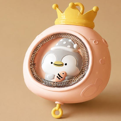 Mobile lit bébé musical et lumineux rose zoom veilleuse couronne dorée pingouin detail