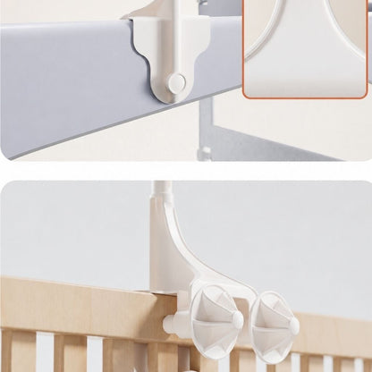 fixation du bras blanc renforcé du mobile musical bébé rotatif sur un lit à barreaux avec double vis