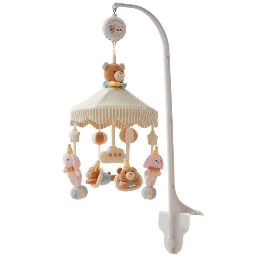 mobile musical bébé rotatif Pompon avec bras blanc, ours, lapins roses en chapeau de fête et ballons sur fond blanc