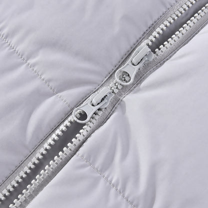 Gros plan sur le double zip du nid d'ange doudoune