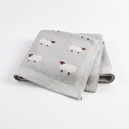 Plaid bébé en coton gris avec moutons brodés, plié