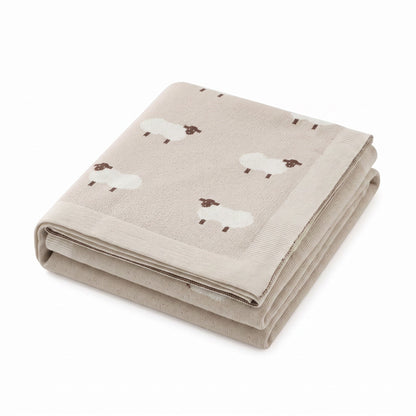 Plaid bébé en coton beige avec moutons brodés, plié, photo produit