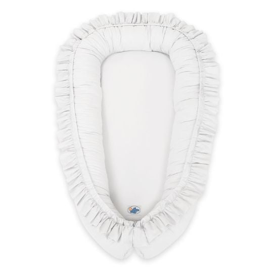 Réducteur de lit bébé à volants blanc, vue de dessus