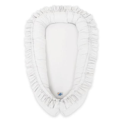 Réducteur de lit bébé à volants blanc, vue de dessus