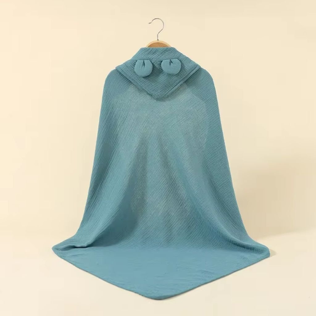 Réducteur de lit bébé bleu pétrole utilisable dès la naissance