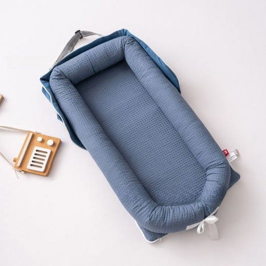 Réducteur de lit bébé confortable pour un sommeil paisible
