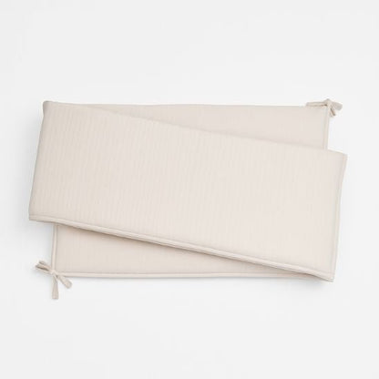 Tour de lit bébé beige doux et sécurisant pour lit à barreaux