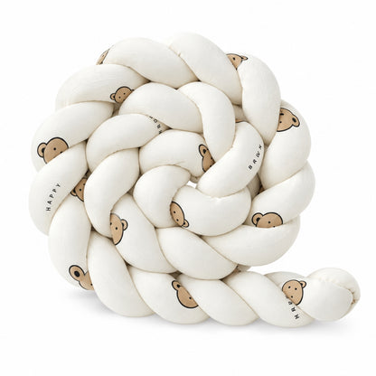 Tresse de lit enfant motif ourson enroulée sur fond blanc