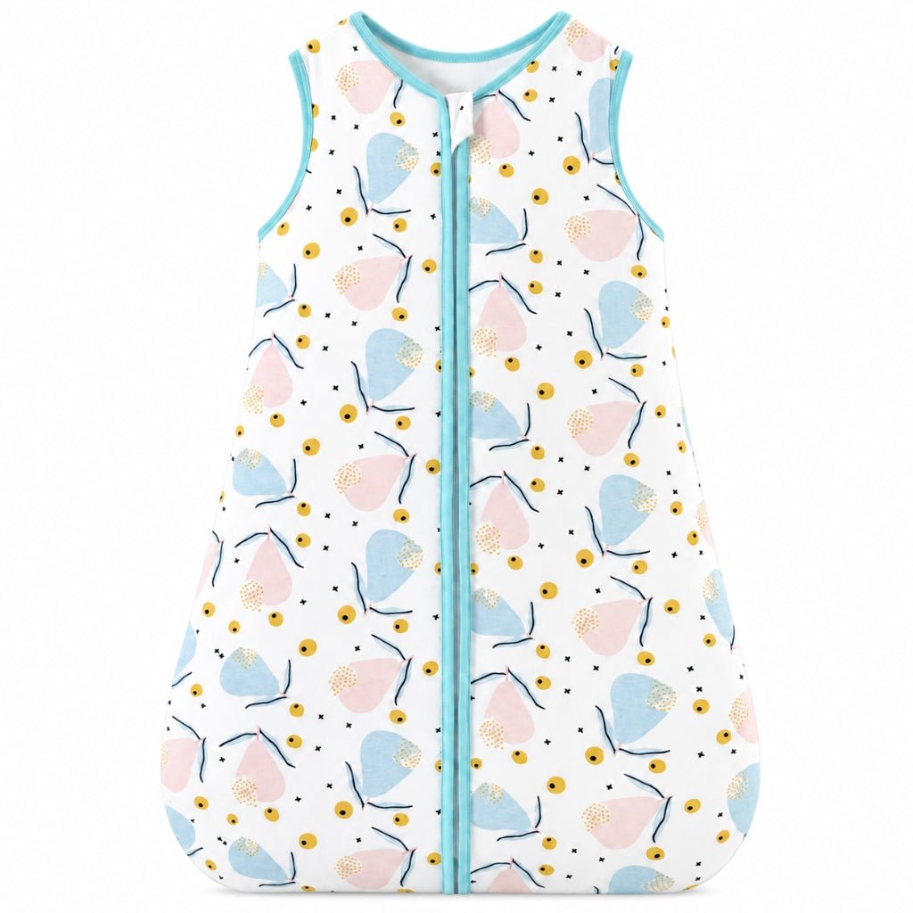 Turbulette bébé TOG 1.5 à motif pétales pastel rose et bleu, biais turquoise